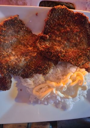 Una foto de Milanesa dorada