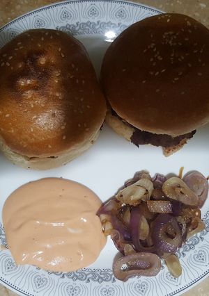 A picture of Creamy Beef Burger with Dip sauce and Caramelized Onions.
