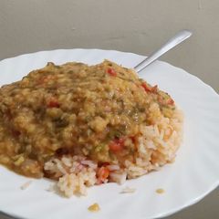 A picture of Lentil served with rice.