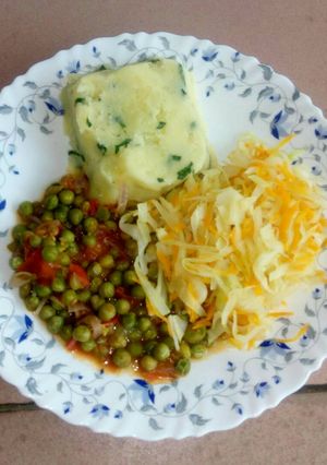 A picture of Mashed potatoes, fried peas and steamed cabbage.