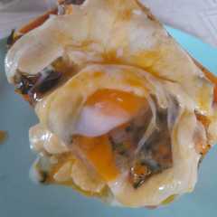 Una foto de Calabaza rellena con muzzarella, espinaca y huevo