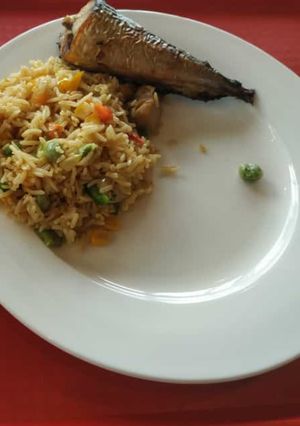 A picture of Fried rice with fried fish.