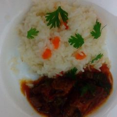 A picture of Carrot Rice with Beef stew.