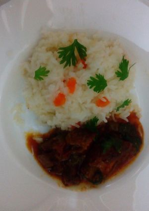 A picture of Carrot Rice with Beef stew.