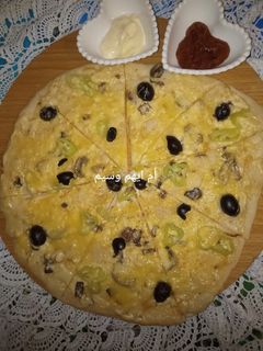 صورة لوصفة بيتزا بالصلصة البيضاء