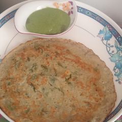 A picture of Bajra atta, sooji, curd, rice powder, coriander leaves uttapam.