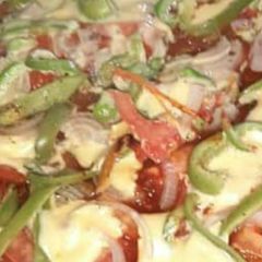 A picture of Pizza for kids without maida and yeast.