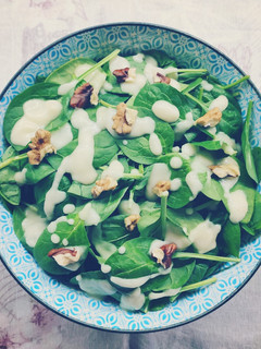 A picture of Baby Spinach Salad with Pear and Walnut Vinaigrette.
