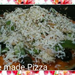 A picture of Home made pizza in a pan.