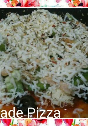 A picture of Home made pizza in a pan.