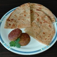 A picture of Paratha and Beef Boti Kabab.
