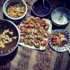 A picture of Homemade golgappe with tangy mangy spicy juice🍸.