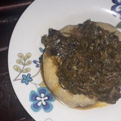 A picture of Eba and vegetable soup.