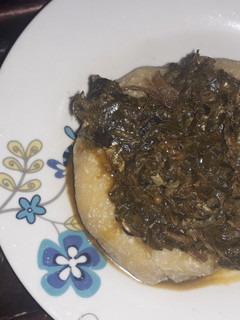 A picture of Eba and vegetable soup.