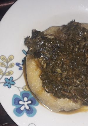 A picture of Eba and vegetable soup.