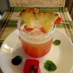 A picture of Pineapple juice with Rose syrup ice cubes#4weekchallenge.