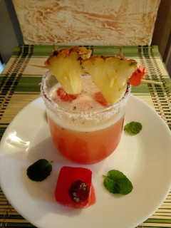 A picture of Pineapple juice with Rose syrup ice cubes#4weekchallenge.