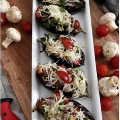 A picture of Stuffed Veggie-Mushroom-Tofu Baked Aubergine Boats.