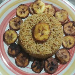 A picture of Jollof rice with fried plantain.