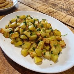 Spicy Lebanese Potatoes in an air fryer- Batata harra A picture of Spicy Lebanese Potatoes in an air fryer- Batata harra.