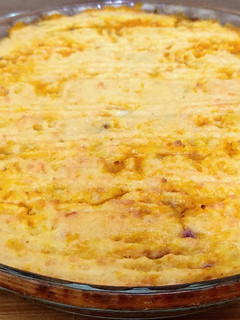 Una foto de Pastel de calabacín y boniato relleno de lentejas