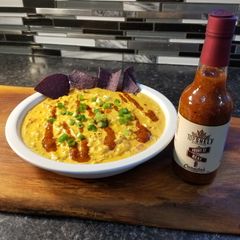 A picture of Top Shelf chicken queso dip.