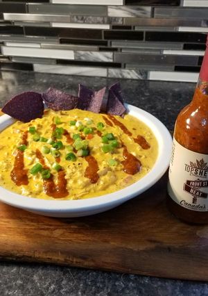A picture of Top Shelf chicken queso dip.