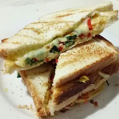 A picture of Egg Sandwich with Veggies and Cheese *Vegetarian.
