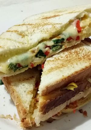 A picture of Egg Sandwich with Veggies and Cheese *Vegetarian.