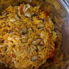 A picture of Palm oil jollof rice and beans.