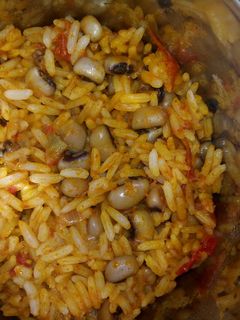 A picture of Palm oil jollof rice and beans.