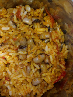 A picture of Palm oil jollof rice and beans.