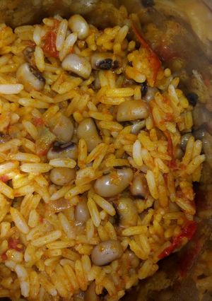 A picture of Palm oil jollof rice and beans.