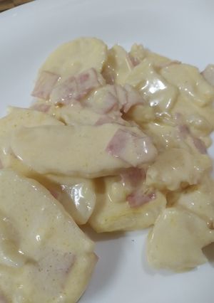 A picture of Baked Potatoes with Ham, Cream, and Cheese.