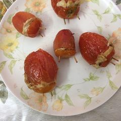 A picture of Stuffed tomatoes with egg.