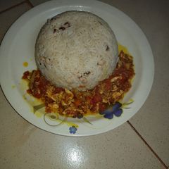A picture of Rice and Beans with Sauce.