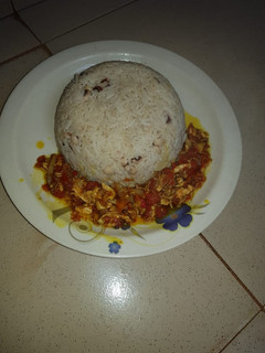 A picture of Rice and Beans with Sauce.