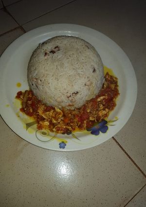 A picture of Rice and Beans with Sauce.