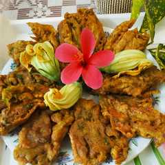 A picture of কুমড়ো ফুলের বড়া। Crispy Pumpkin flowers fry or fritters.