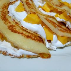 A picture of Mango stuffed crepes.