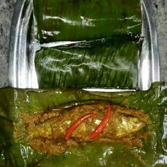 A picture of Banana leaf steam fish.
