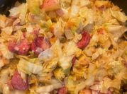 A picture of fried cabbage and potatoes