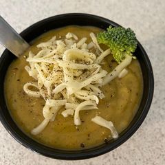 A picture of Vegetable cream soup with cheese.