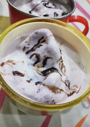 A picture of Banana shake with black current ice cream.