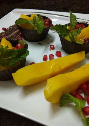 A picture of Mango Mousse in Chocolate Tarts.