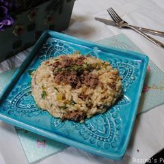 A picture of Venison sausages risotto.