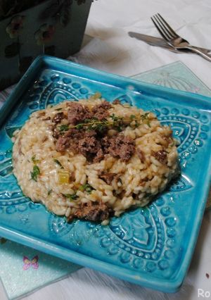 A picture of Venison sausages risotto.