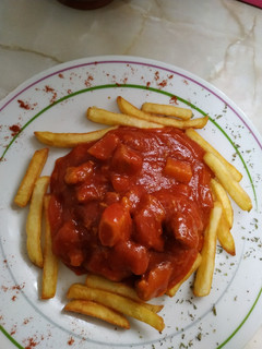 Una foto de Magro de cerdo con tomate y patatas