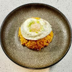 Kimchi fried (with bacon and a fried egg) A picture of Kimchi fried (with bacon and a fried egg).