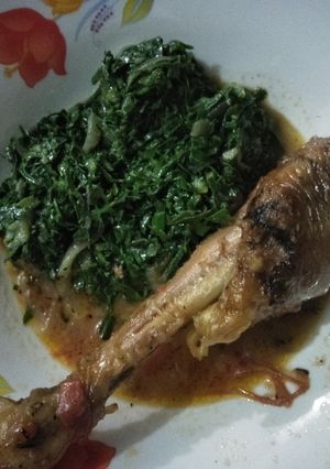A picture of Chicken stew with greens.